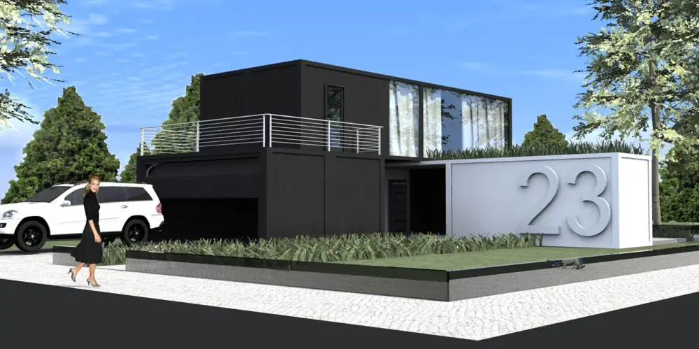 Two-storey dark modular home with a balcony beside a driveway