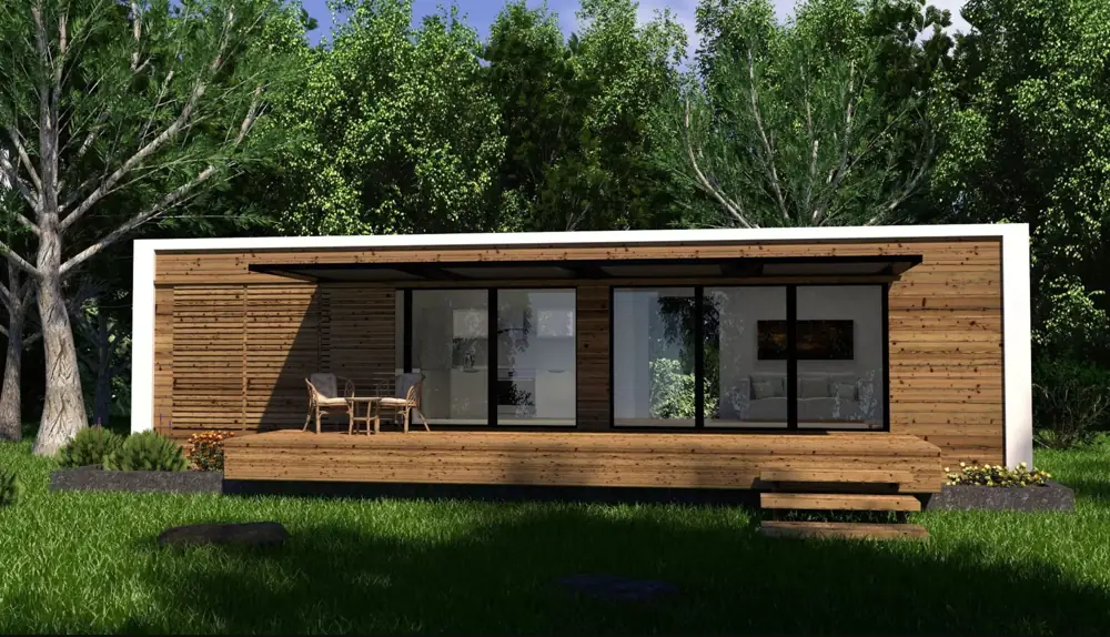 Long tiny house with timber cladding and recessed glazing in greenery