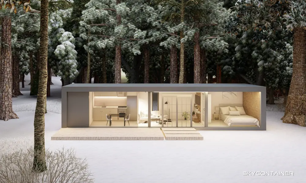 Front view of a compact living module with open glazing in snow
