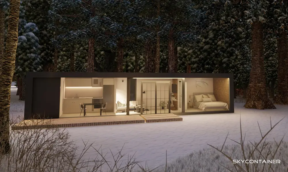 Living module with long glazing and an illuminated interior in a winter forest
