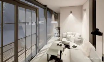 Heller Tiny-House-Wohnbereich mit Sofa und Esstisch entlang einer Glaswand