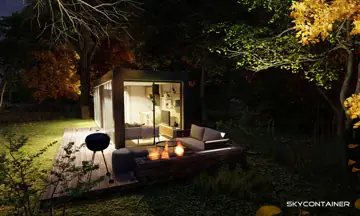 Kleines Container-Gartenhaus mit beleuchtetem Eingang und Sitzplatz unter Bäumen