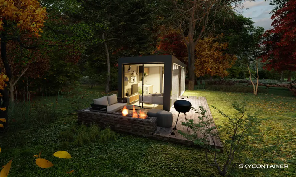 Freestanding mini garden house with a terrace, fire feature and barbecue in an autumn garden