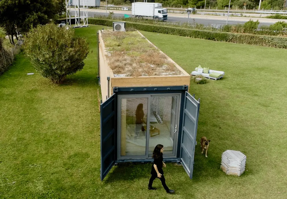 Narrow garden container with a planted roof on a lawn