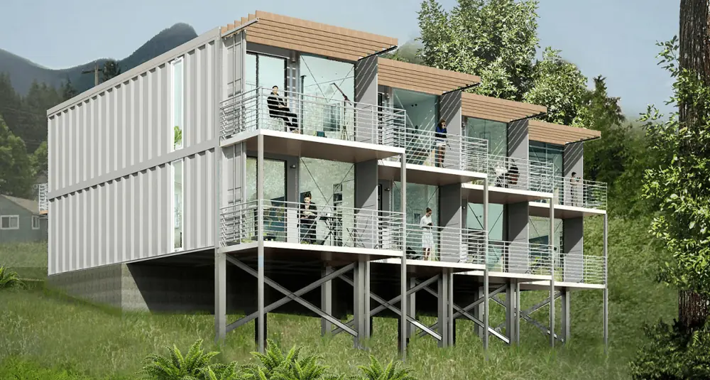 Three-storey container building with external balconies and supports
