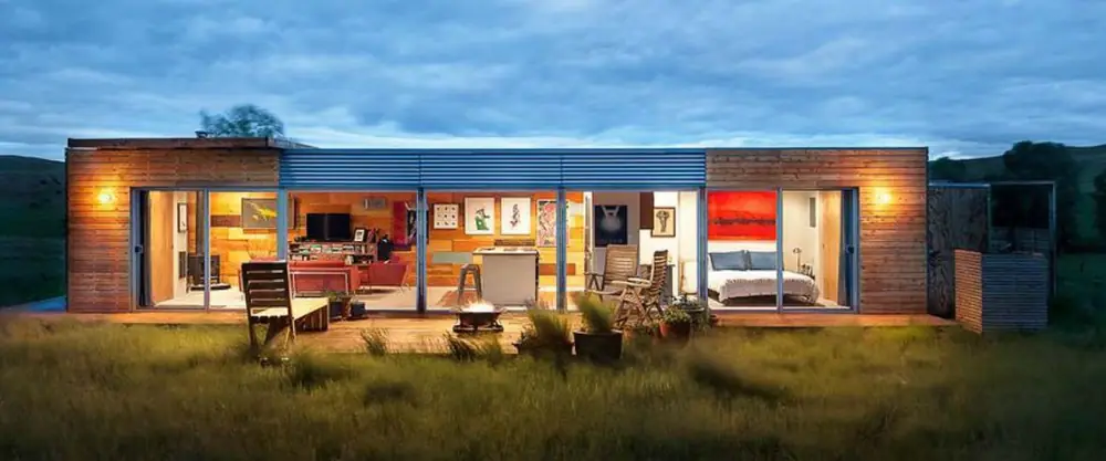 Wide living container concept with open room areas and a timber terrace