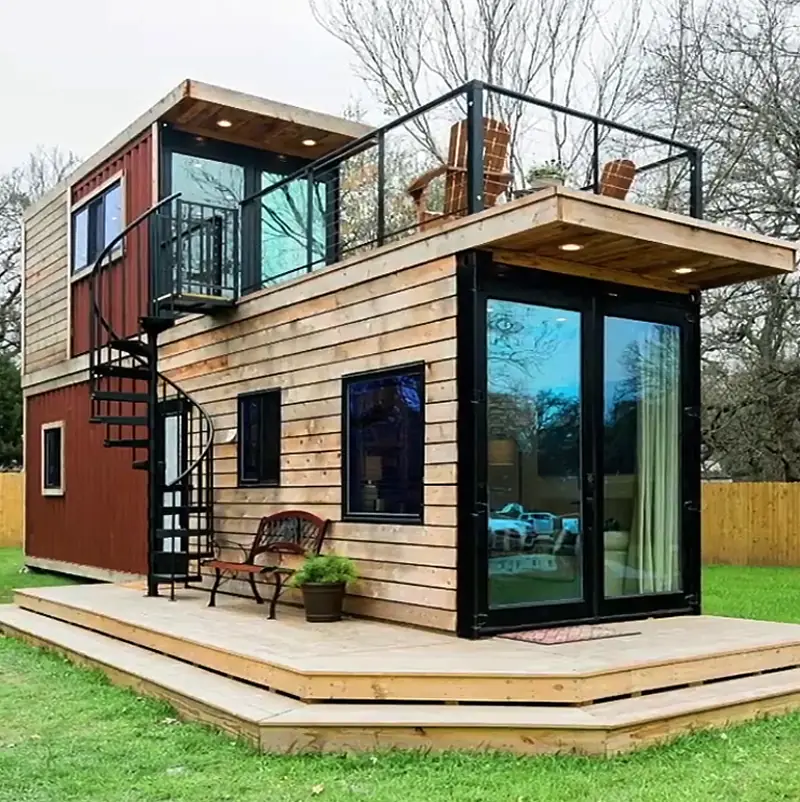Combined timber and container home with an outdoor staircase and roof terrace