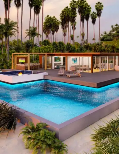 Flaches Containerhaus mit großer Glasfront neben einem beleuchteten Pool