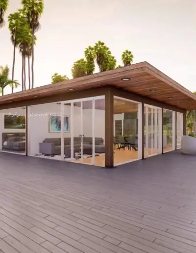 Single-storey house with a timber ceiling and surrounding terrace at sunset
