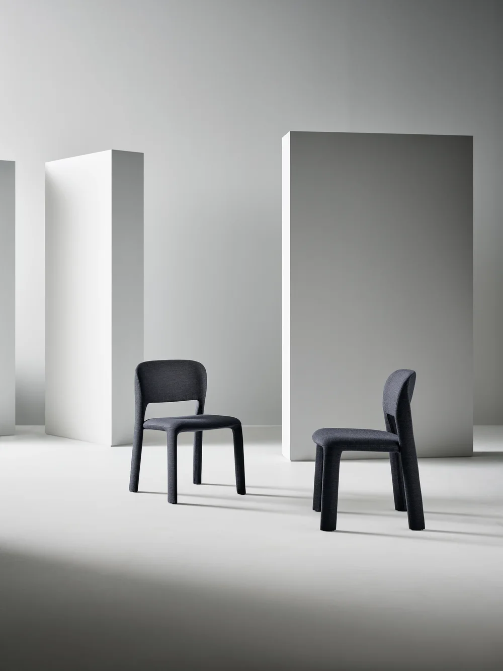 Bonaldo Artemis: Dark fully upholstered chair with soft contours · View 1