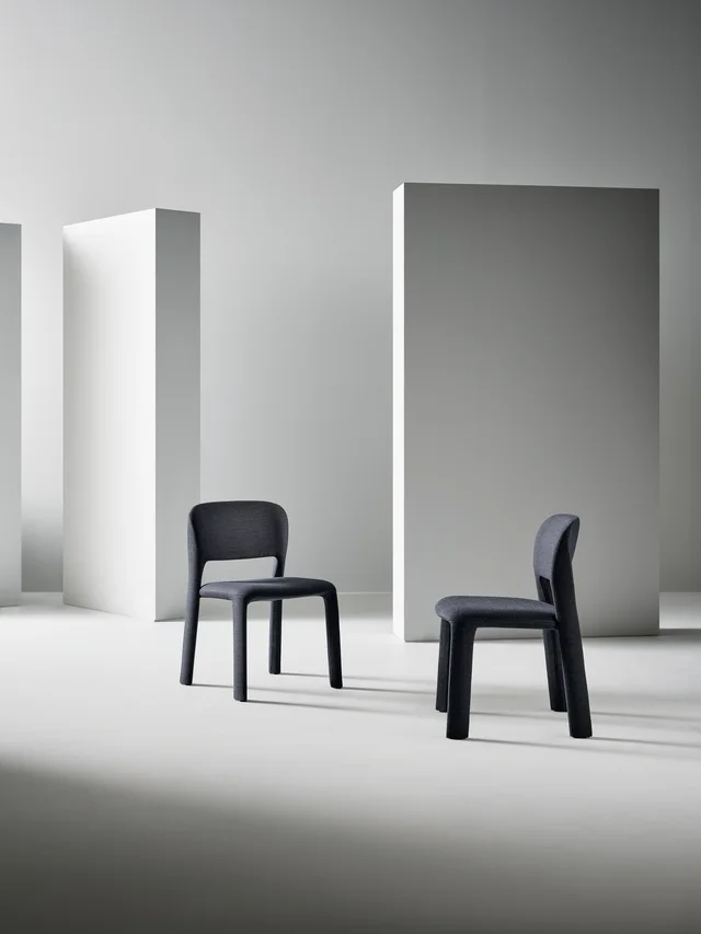 Bonaldo Artemis: Dark fully upholstered chair with soft contours · View 1
