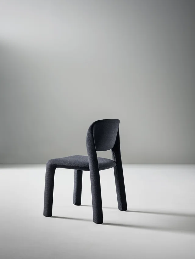 Bonaldo Artemis: Dark fully upholstered chair with soft contours · View 2