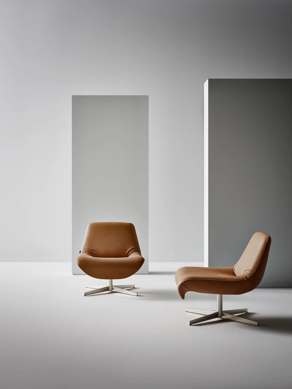 Bonaldo Ellison: Brown lounge chair with a sloping back and four-star base · View 1