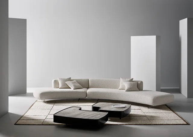 Bonaldo Grant: Long pale sofa with flowing curves and recessed supports · View 2