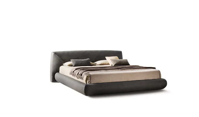 Bonaldo Holden: Dark upholstered bed with a low frame and angled headboard detail · View 5