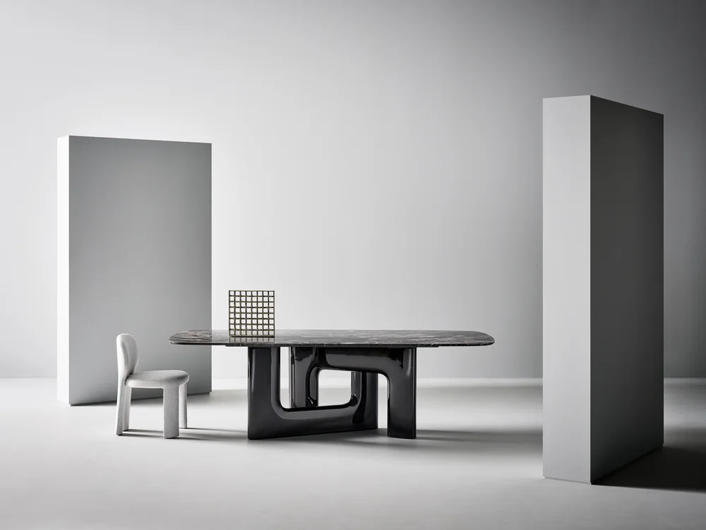 Bonaldo Liaison: Elongated table with a veined top and two open support volumes · View 1