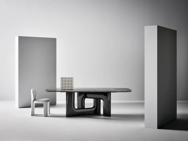 Bonaldo Liaison: Elongated table with a veined top and two open support volumes · View 1