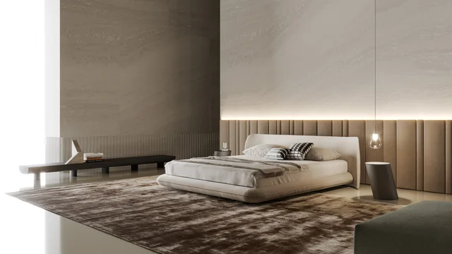 Bonaldo Nubo & Nubo boiserie: Helles gerundetes Bett vor breiter vertikal gegliederter Wandpolsterung · Ansicht 5