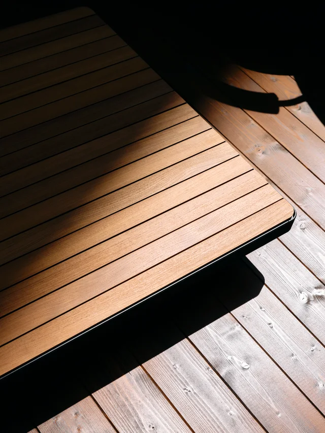 Fast Via Durini 2026: Street-side terrace with warm upholstery, plants and different table surfaces · View 13