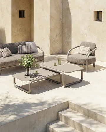 VONDOM GUM: sofa and chairs around a low table with a plant beside the terrace edge