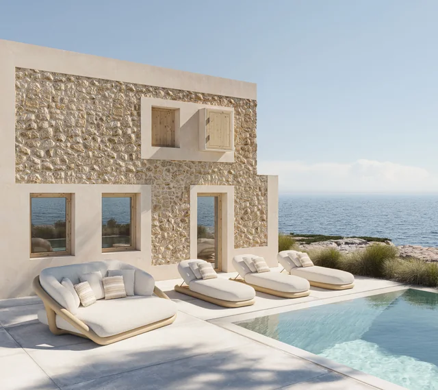 VONDOM MEL: Sofa, Tische und Liegen an einem Pool vor einer steinernen Fassade