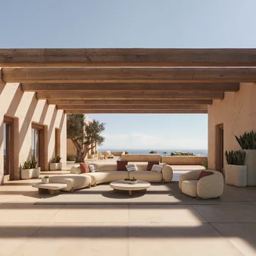 VONDOM MILOS: helle Lounge mit gerundeten Sofas und Tischen unter einer Pergola am Meer