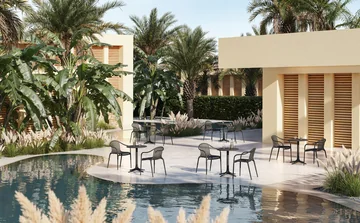 VONDOM PALM: several dark dining groups on a waterside terrace