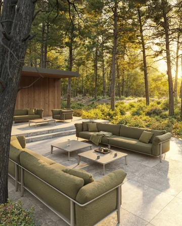 VONDOM PASADENA: back view of a green sofa on a terrace surrounded by trees