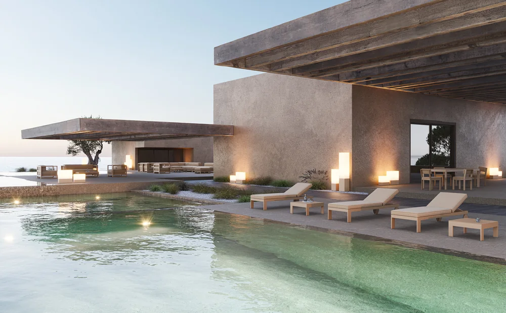 VONDOM POSIDONIA: lange Poolterrasse mit Lounge, Liegen und Leuchten im Abendlicht