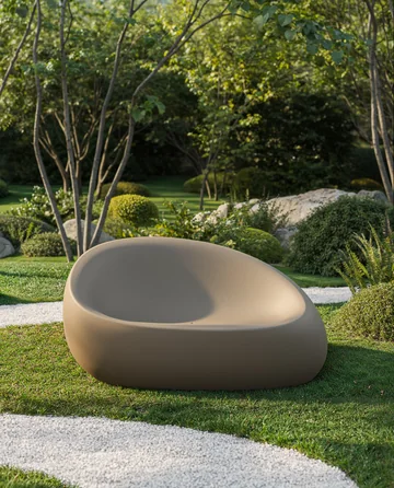 VONDOM STONE: broad taupe seat with a recessed sitting area on a lawn