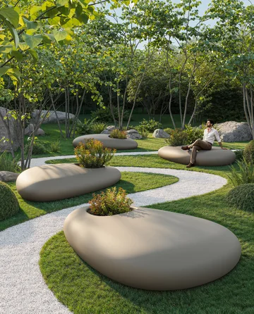 VONDOM STONE: zwei gerundete bepflanzte Tische am geschwungenen Gartenweg